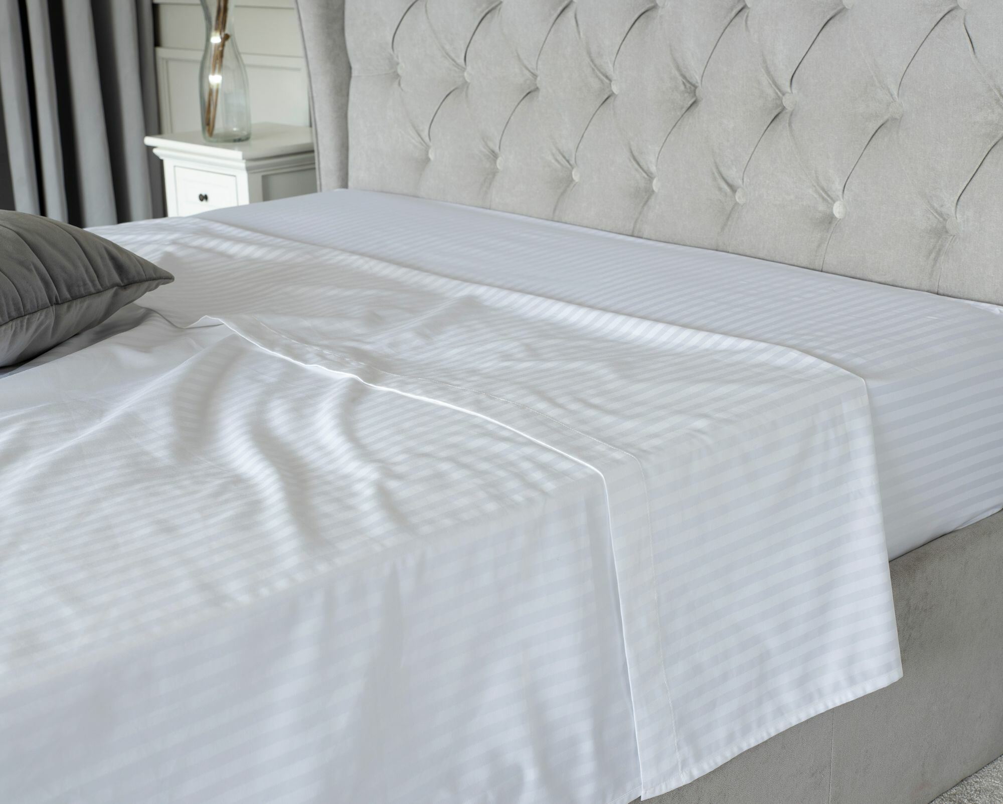 Fitted and Flat Sheet on a bed
